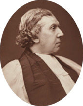 stout, clean-shaven white man in clerical dress