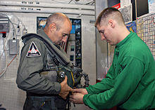 US Navy 031127-N-4669B-001 British Major General Graeme Lamb is fitted for his flight suit by Aircrew Survival Equipmentman 2nd Class Jeffery D. Schmidt.jpg
