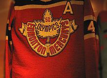 Red coloured jersey with a maple leaf crest