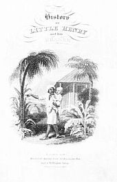 Indian man is holding a young, white boy in his arms and pointing to something. They are standing in front of palm trees and a hut.