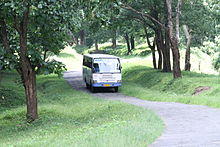 Small bus on a narrow road
