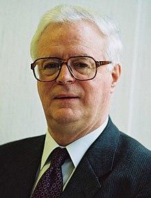 portrait photograph of a 64-year-old Millan