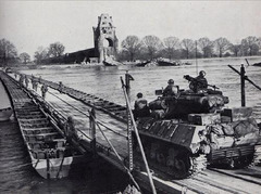 U.S. Army troops cross the Rhine on a heavy pontoon bridge, March 1945[1]