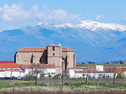 St John the Baptist´s church of Saucedilla, with the Sierra de Gredos snow-covered behind