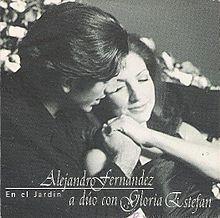 A gray-scaled image of a woman embracing a man next to her