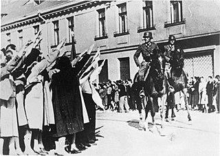 German cavalry enters the Polish city of Łódź Litzmannstadt greeted by members of the city considerable ethnic German community.jpg