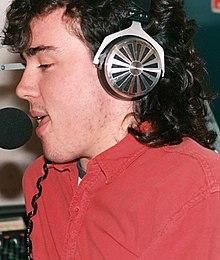 A man singing into a microphone.