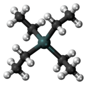 A gray-green sphere linked to four black spheres, each, in turn, linked also to three white ones