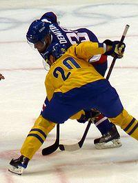 Henrik Sedin Pavol Demitra faceoff.jpg