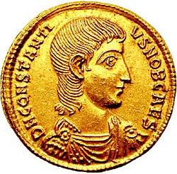 Golden coin depicting man facing right
