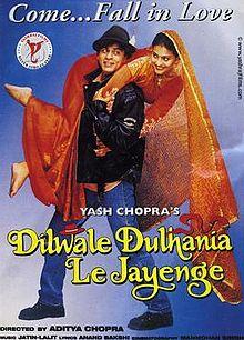 The Dilwale Dulhania Le Jayenge theatrical release poster shows a man in a black leather jacket and blue jeans holding over his shoulders a woman in a red wedding dress. A caption on top reads "Come...Fall in Love".