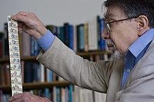 Dr Jones shows some cartoon frames from a cardboard animation device he built as a boy